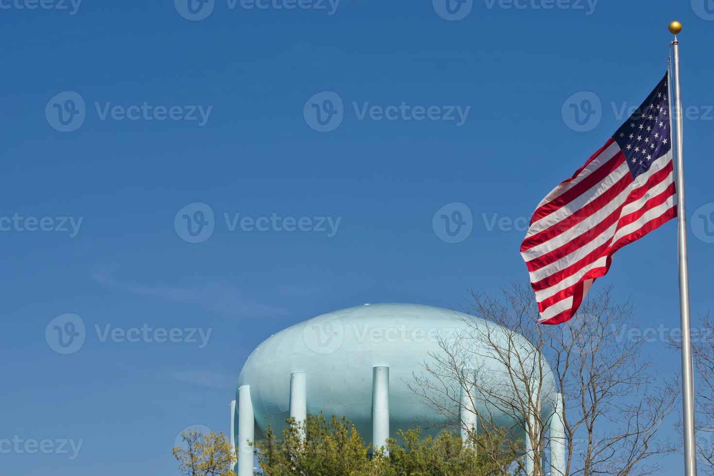 A water tower in the deep blue sky photo