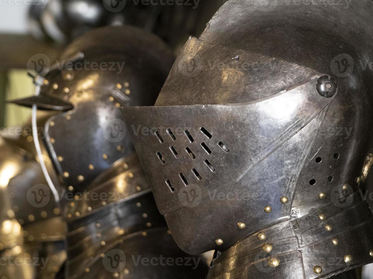 many medieval iron metal helm armor photo