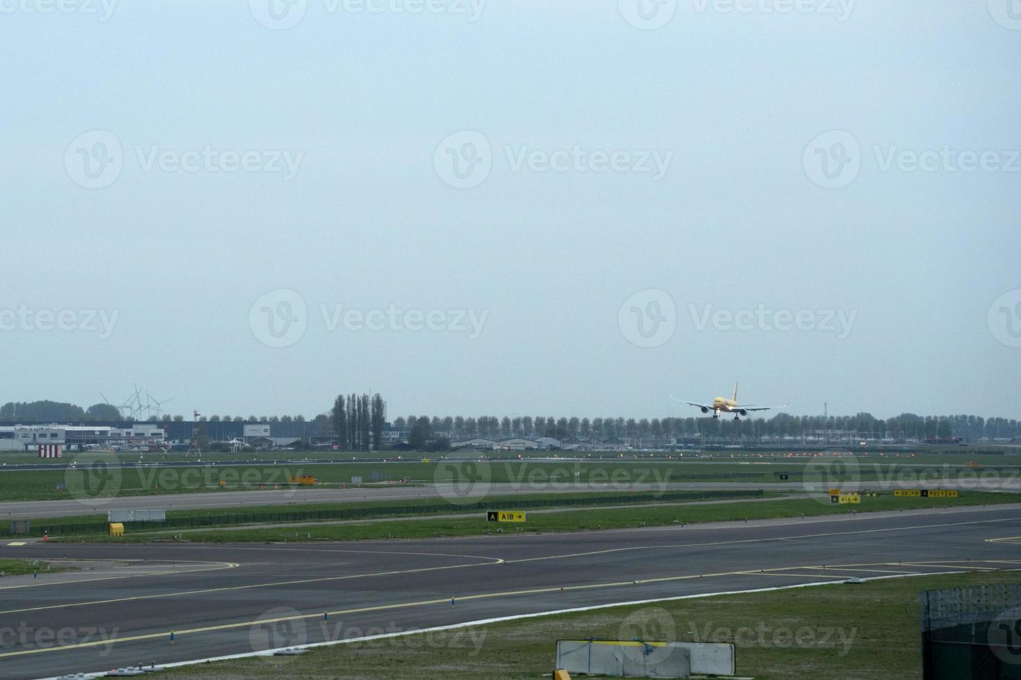 airplane landing at schipol airport amsterdam photo