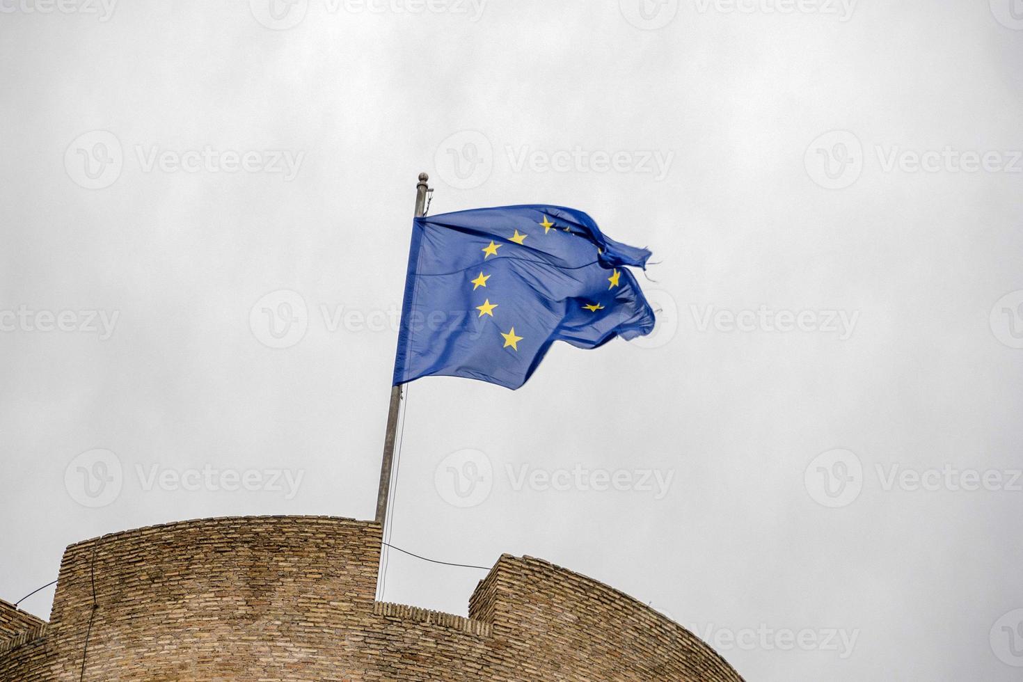 eu flag waving on castel sant angelo rome photo