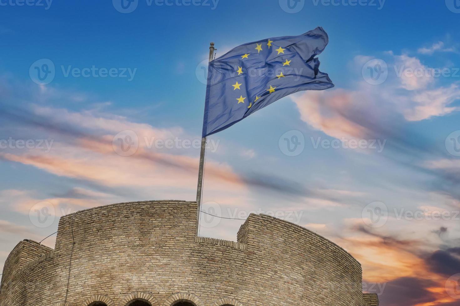 eu flag waving on castel sant angelo rome photo