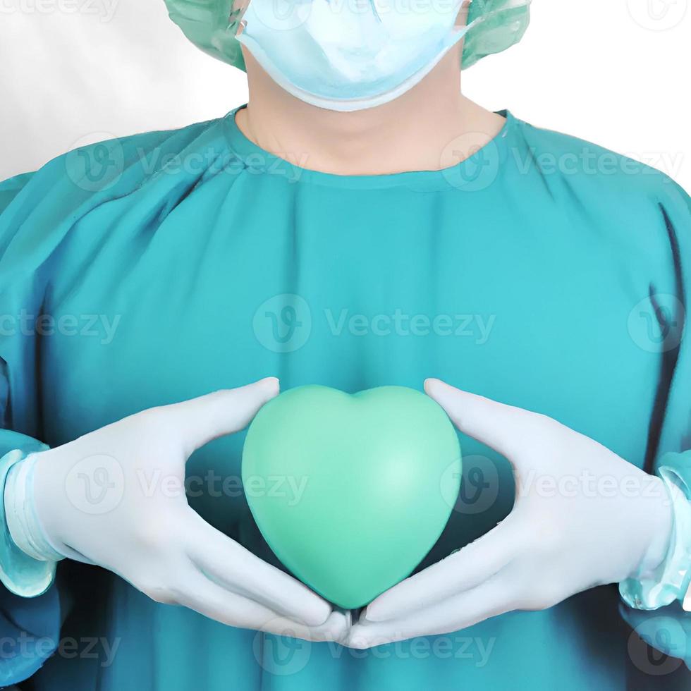 Surgeon holding a green hearth photo