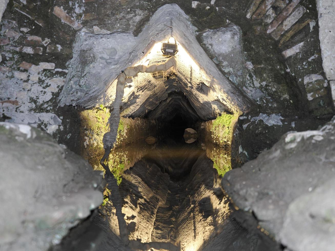 water channel inside Colosseum Rome interior view at night photo