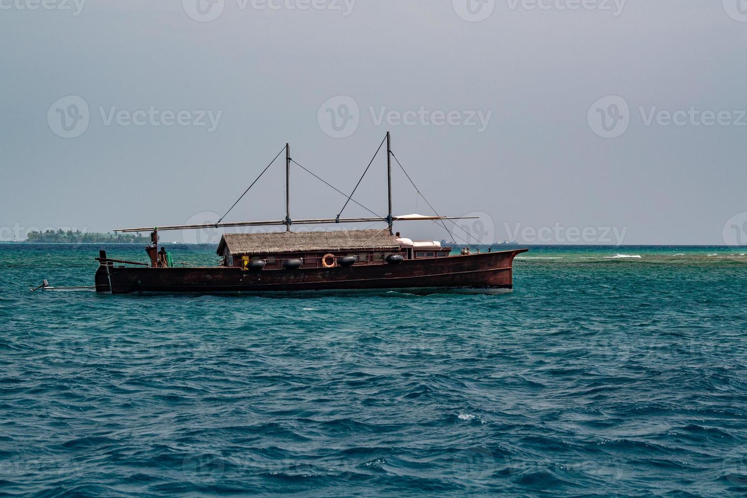 maldivian fishing fishermen boat in maldives at surise photo