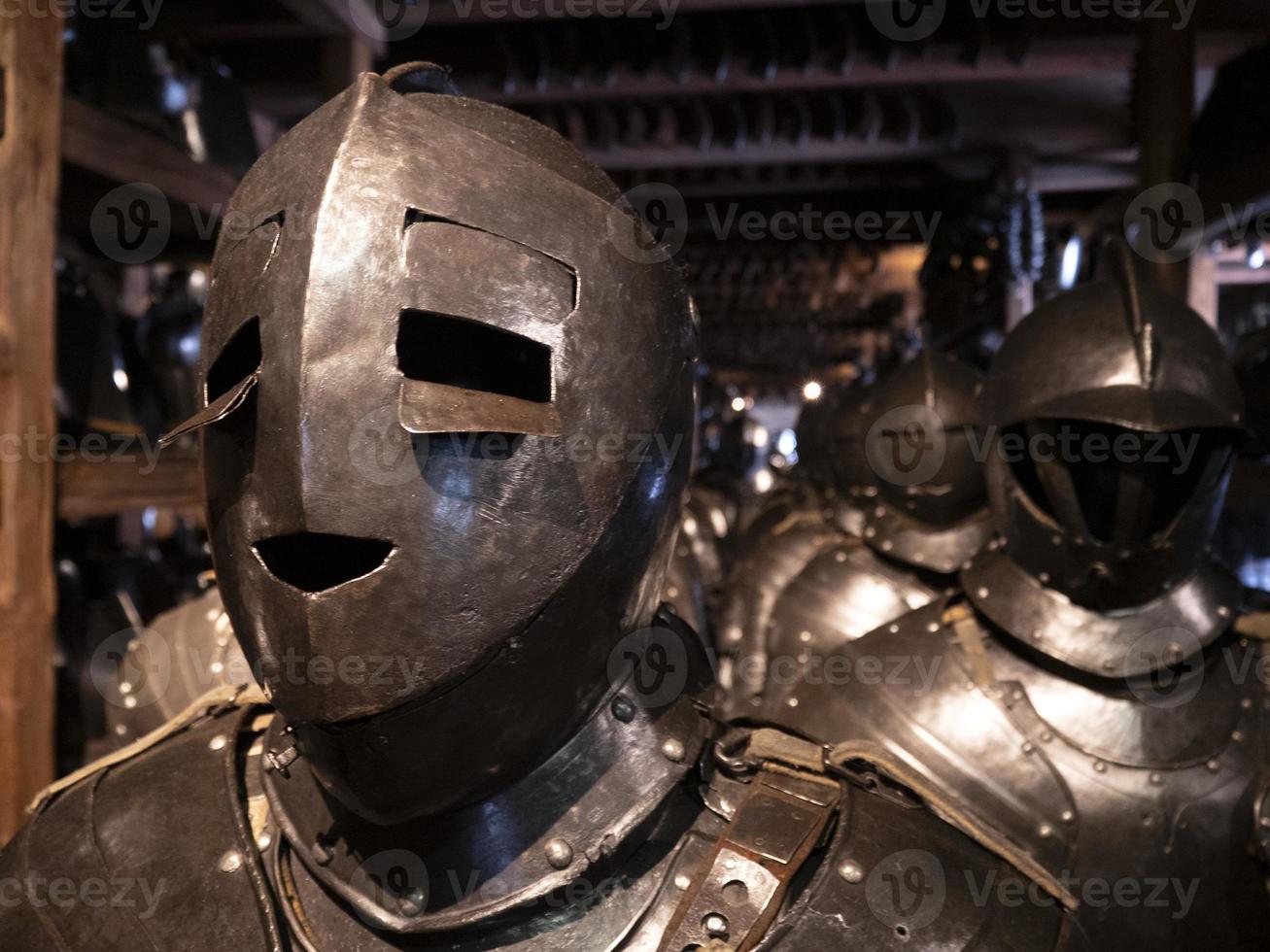 many medieval iron metal helm armor photo