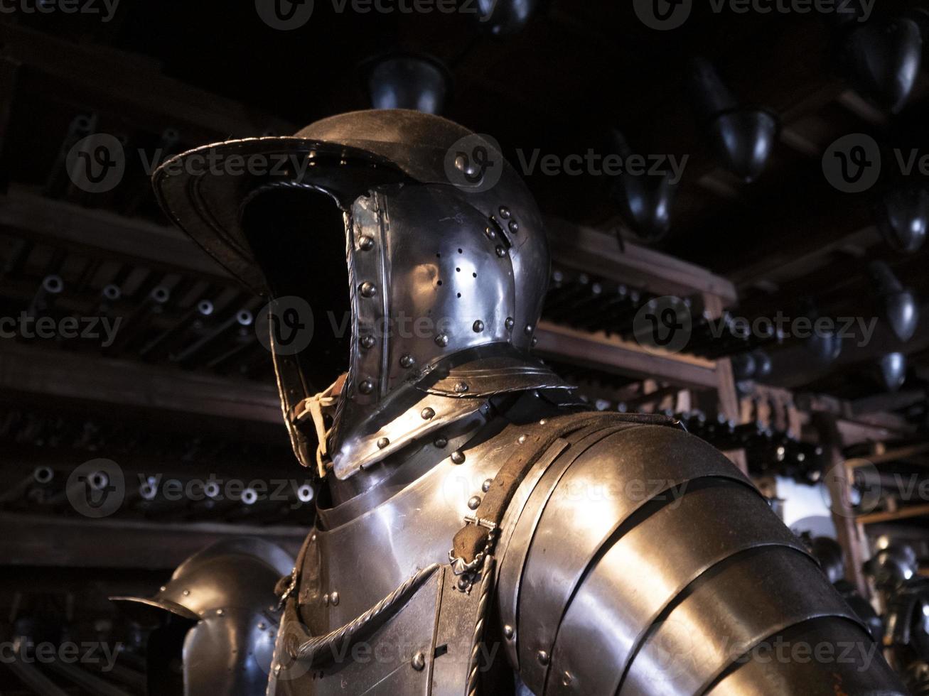 many medieval iron metal helm armor photo