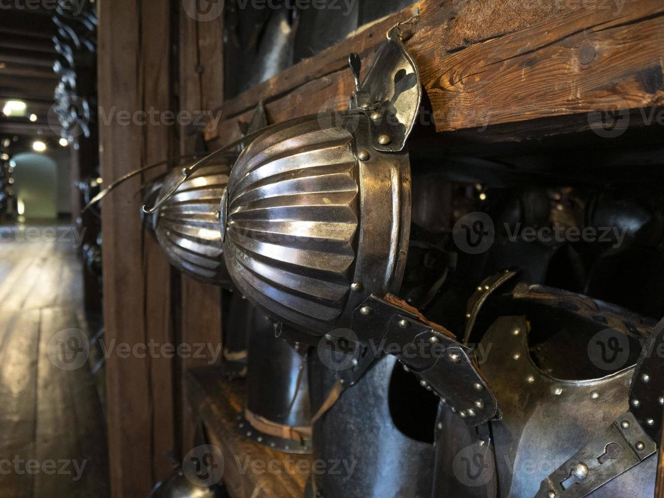 many medieval iron metal helm armor photo