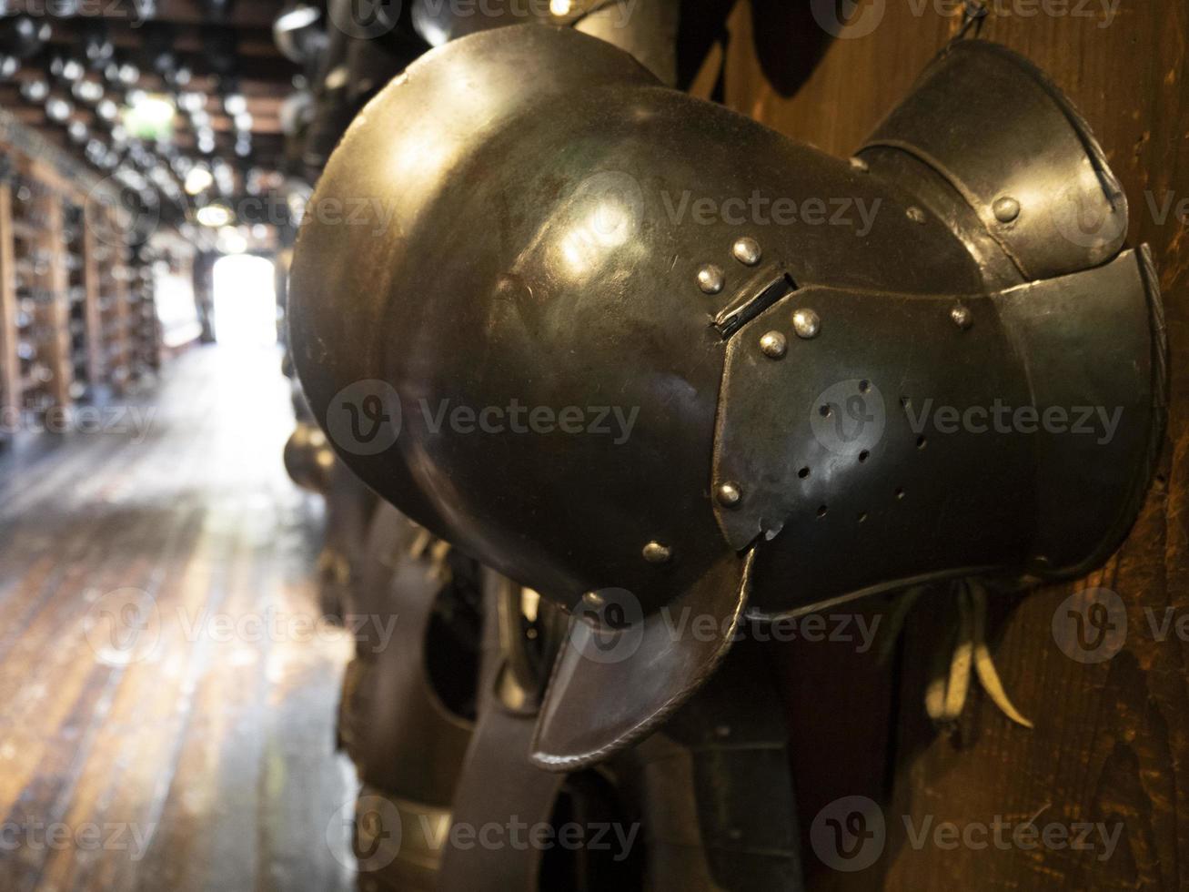 many medieval iron metal helm armor photo