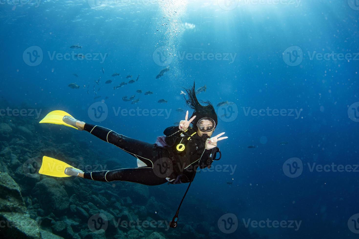 beautiful latina mexican girl diving in cortez sea photo