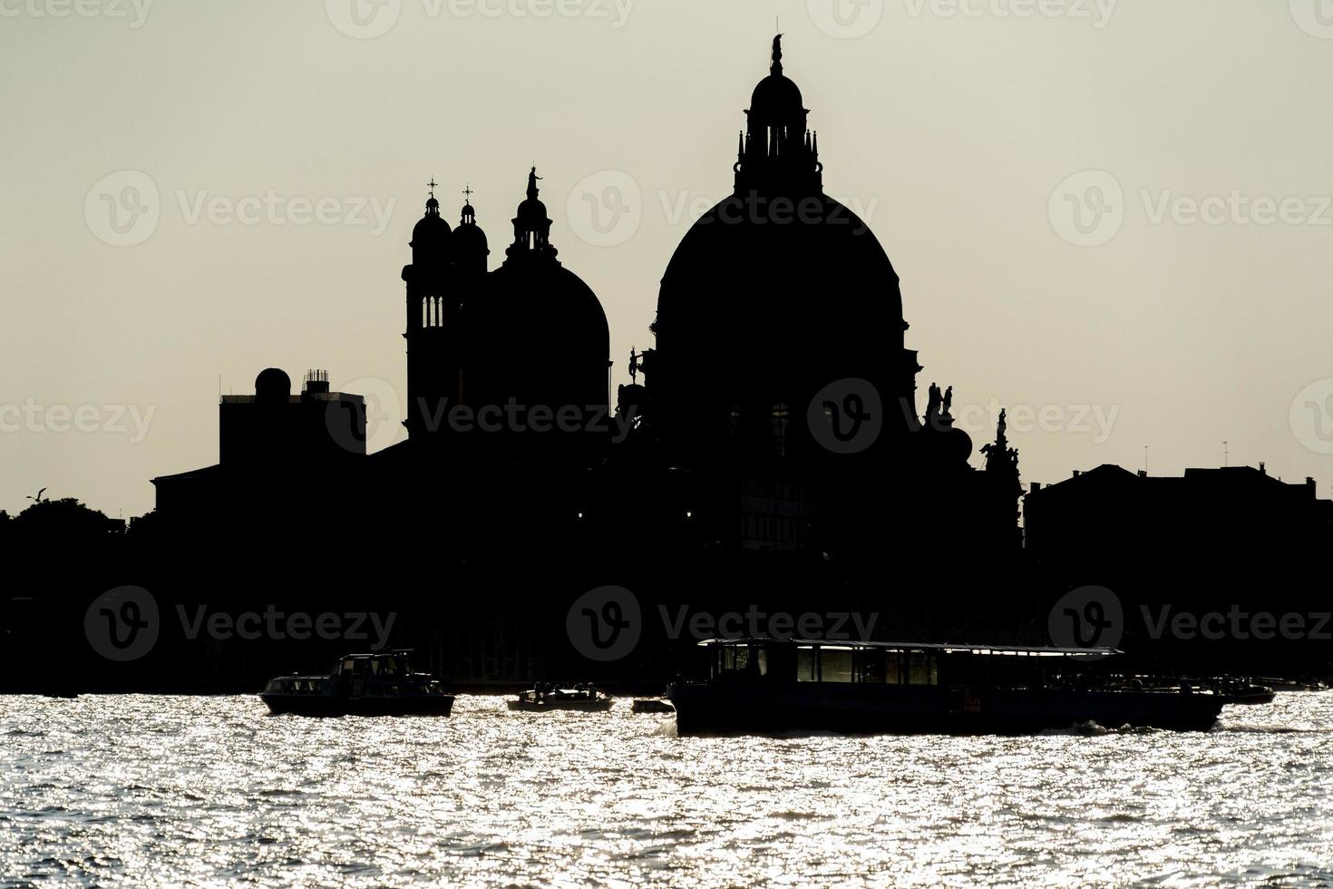 Venice cityscape silhouette at sunset photo