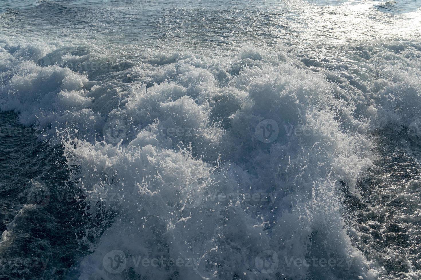 motor boat ship wake detail at sunset photo