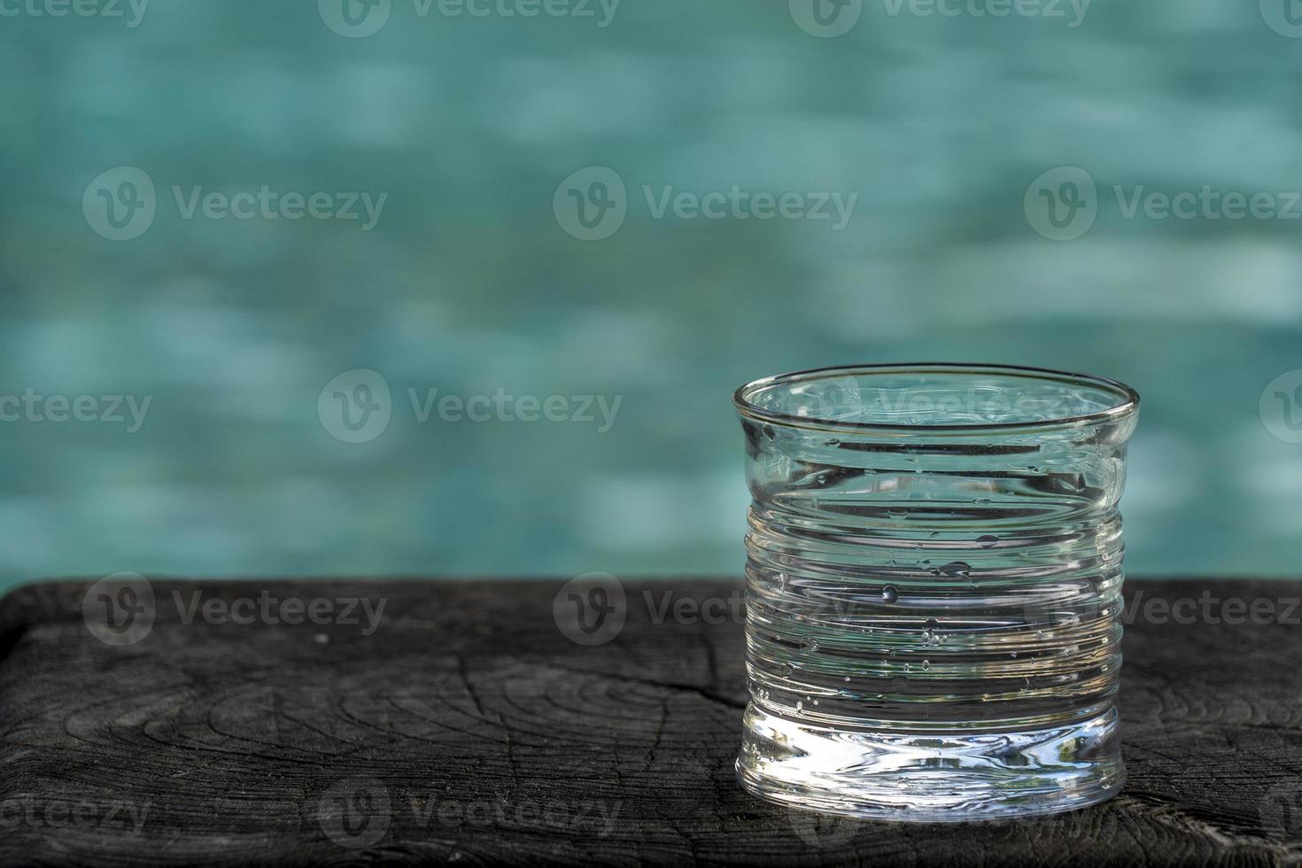 drink glass on pool background photo
