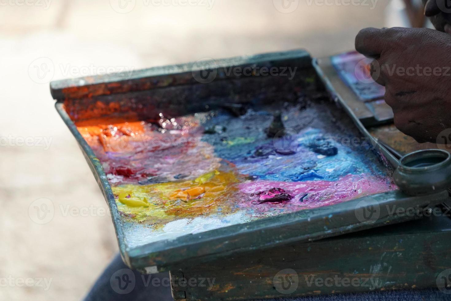 Man painting with hand photo