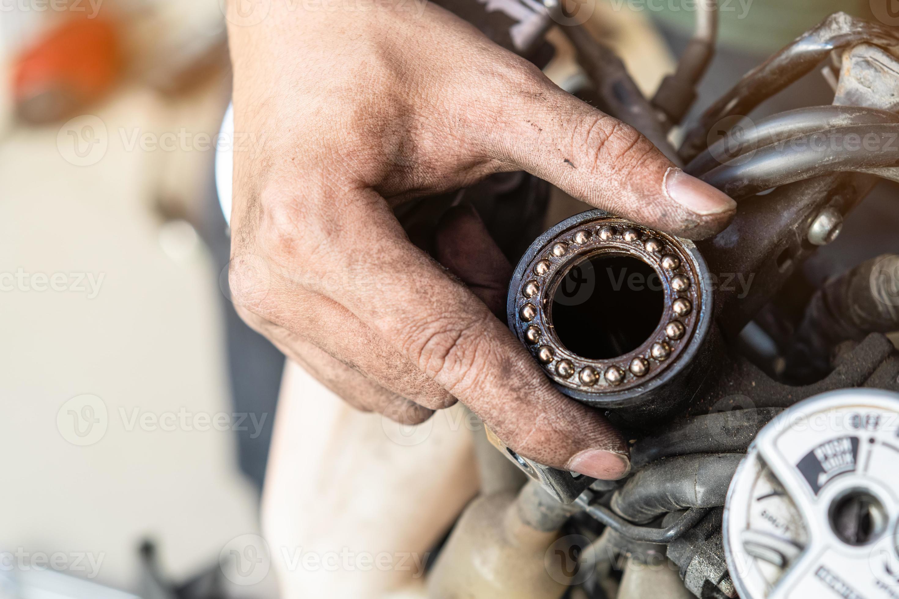 Mechanic inspect and adjust Motorcycle Steering Head Bearings