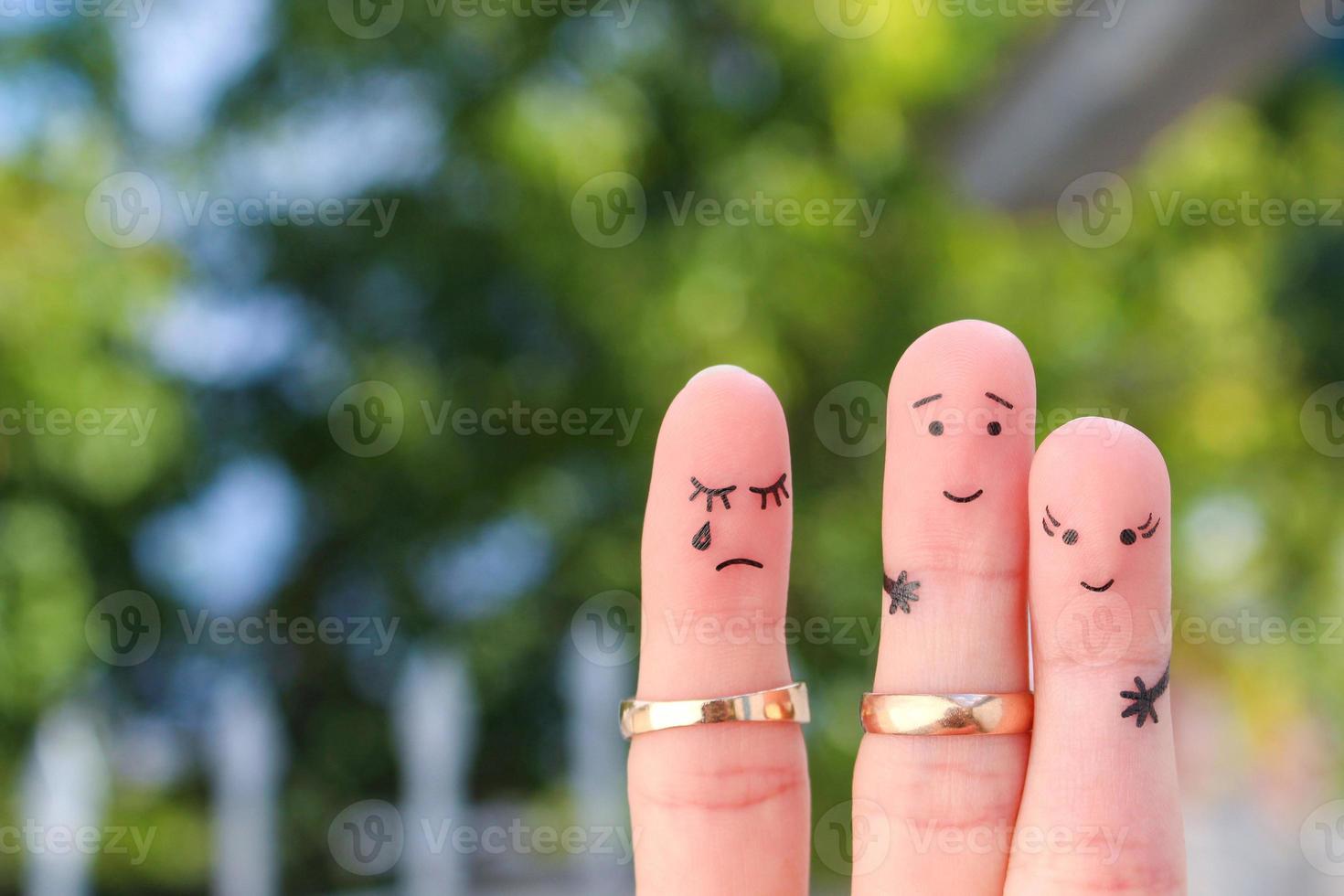 Fingers art of people. The husband kisses another woman, the wife is jealous. photo