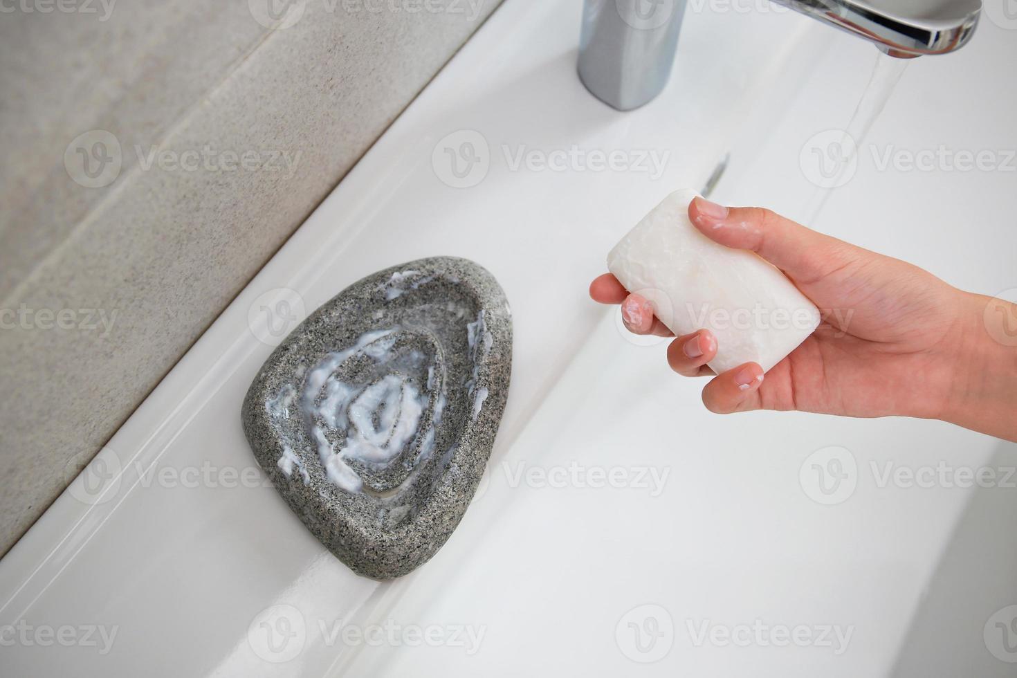 The wet soap has gone sour in the soap dish. photo