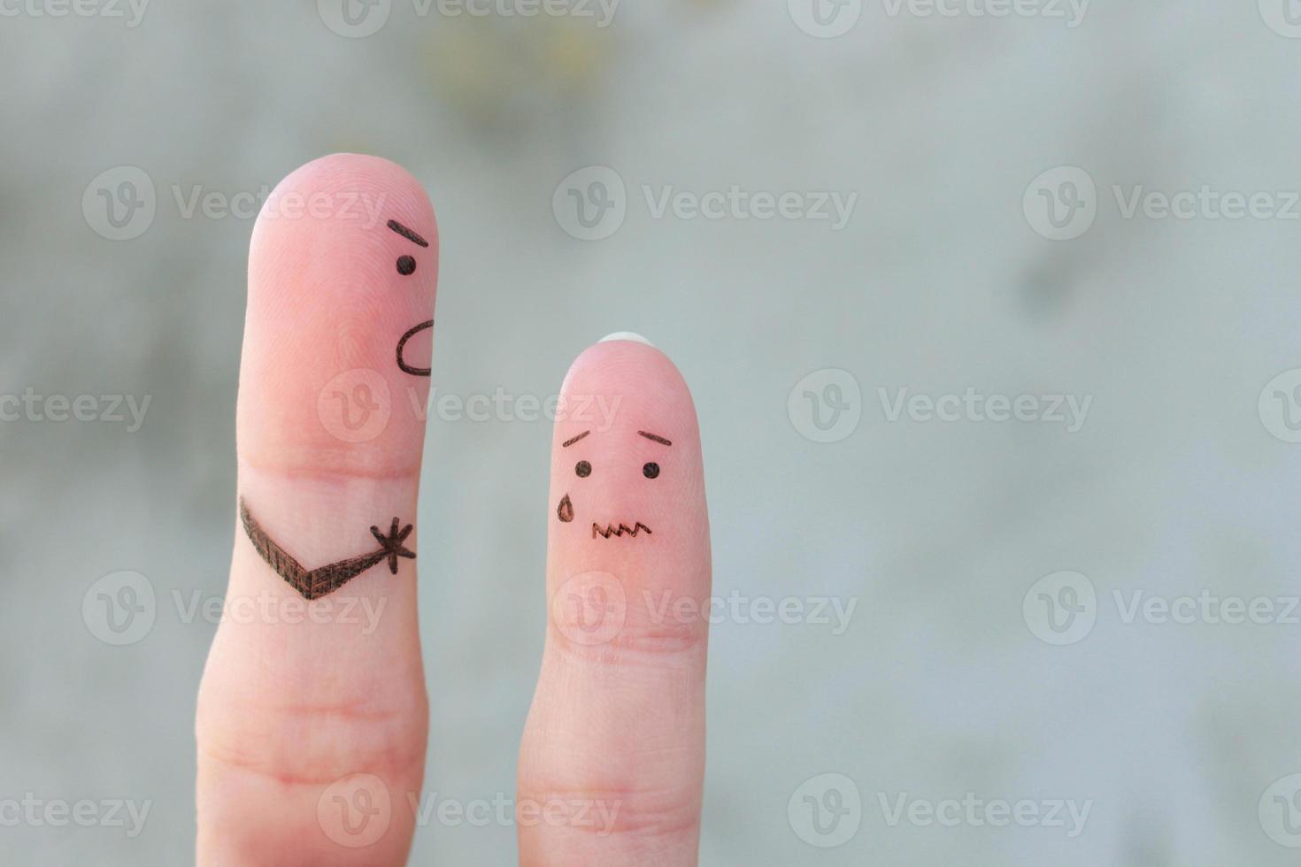 Fingers art of family during quarrel. The concept of father scolded his son, he was crying. photo