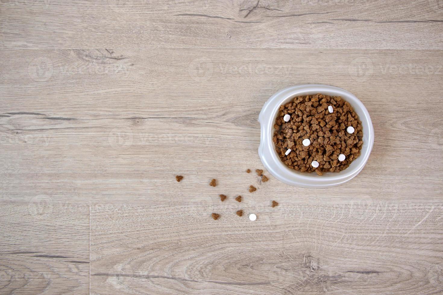 Dry food with vitamins for cats and dogs. Top view. photo