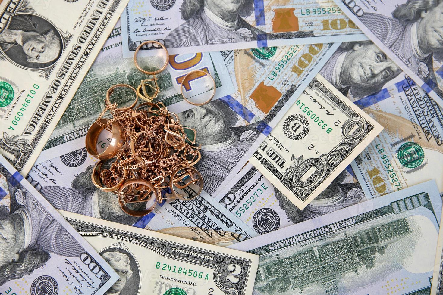 Jewelry on the background of American dollars. Top view. photo