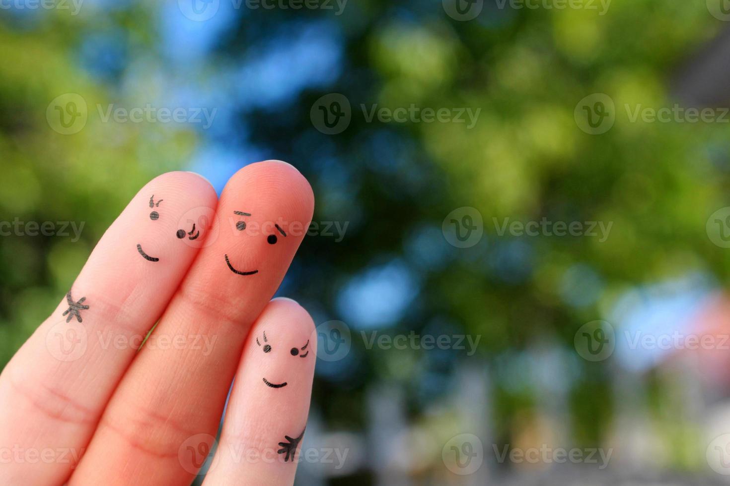 Fingers art of happy family of mixed race. photo