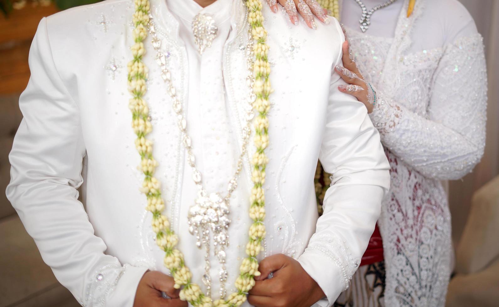 Groom and Bride in White Wedding Dress photo