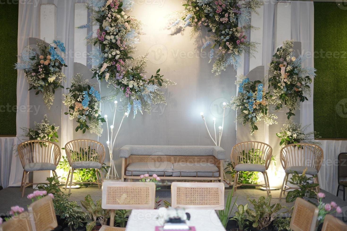 Beautiful Wedding Decoration with Flowers, Leaves and Lamps photo