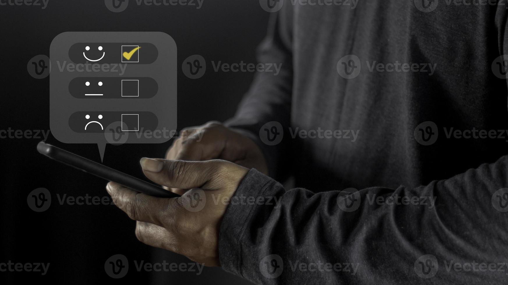 Businessman pressing smiley face emoticon on virtual touch screen. User give rating to service experience on online application for Customer review satisfaction feedback survey concept. photo