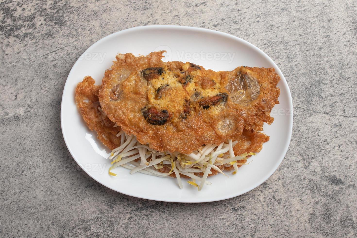 Fried mussels in crispy batter in a white plate photo
