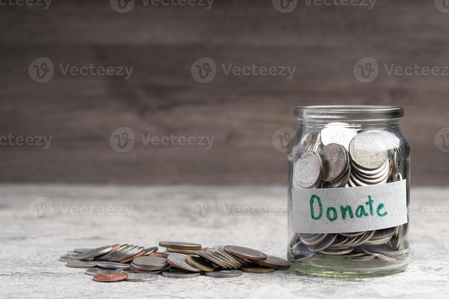 Glass jar with coins, monetary donations.Copy space photo