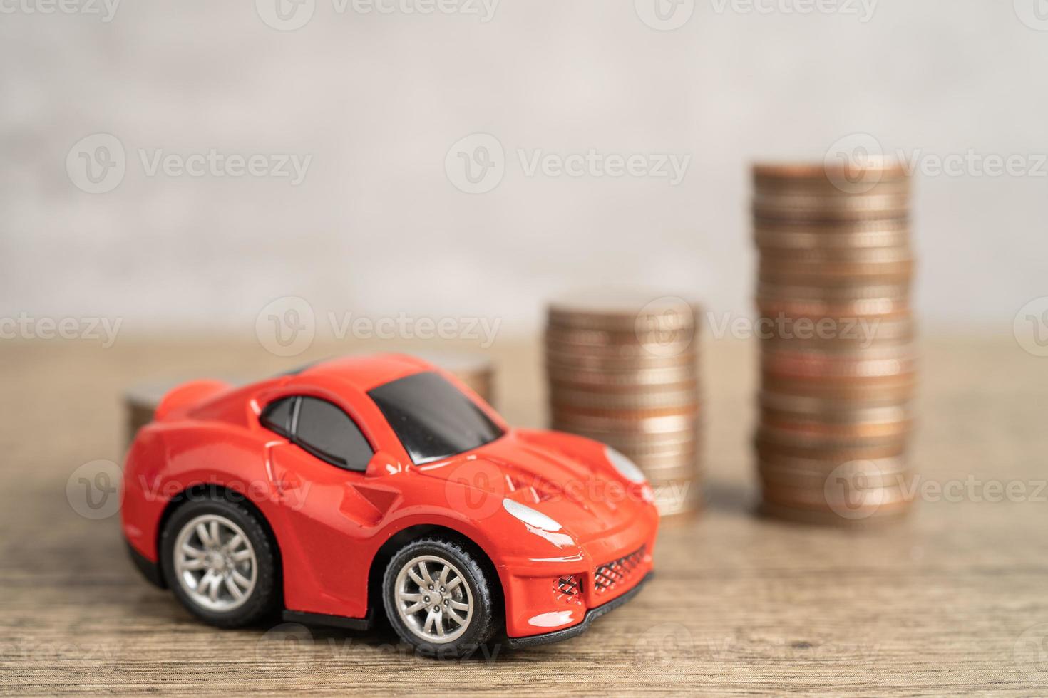 Bangkok, Thailand, June 1, 2022 Car on coins and calculator Car loan, Finance, saving money, insurance and leasing time concept. photo