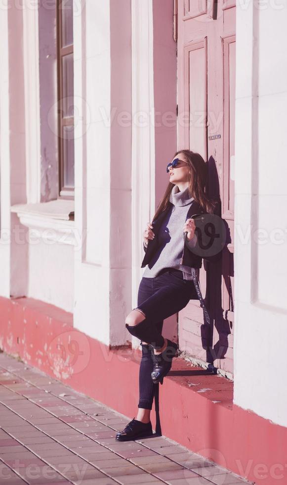 lifestyle fashion portrait of young stylish hipster woman photo