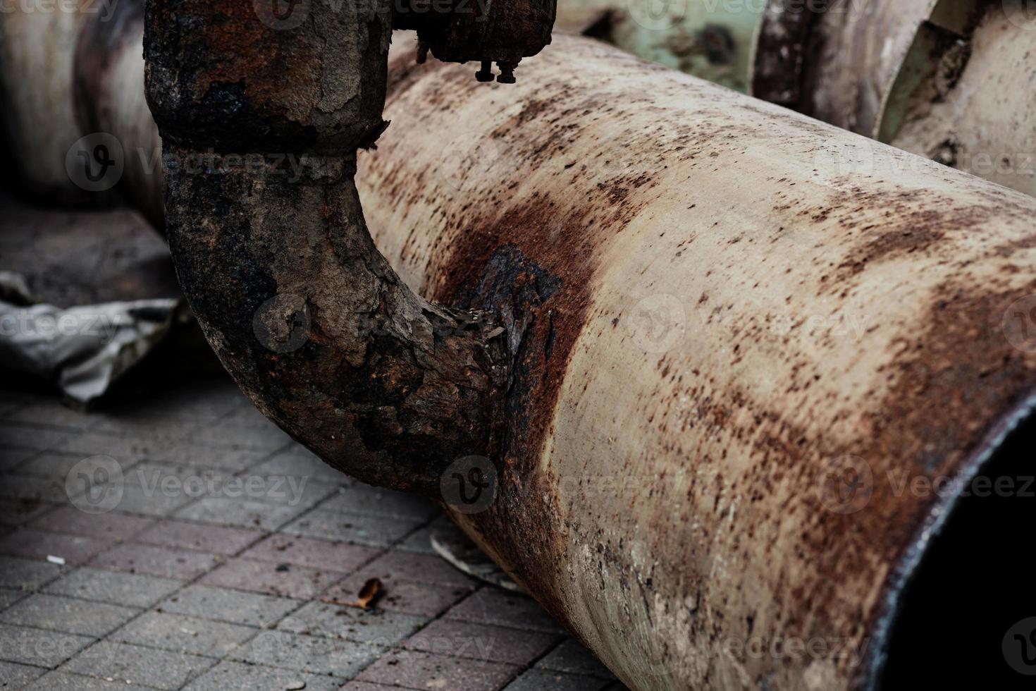 Fragments of old cast-iron water pipes photo