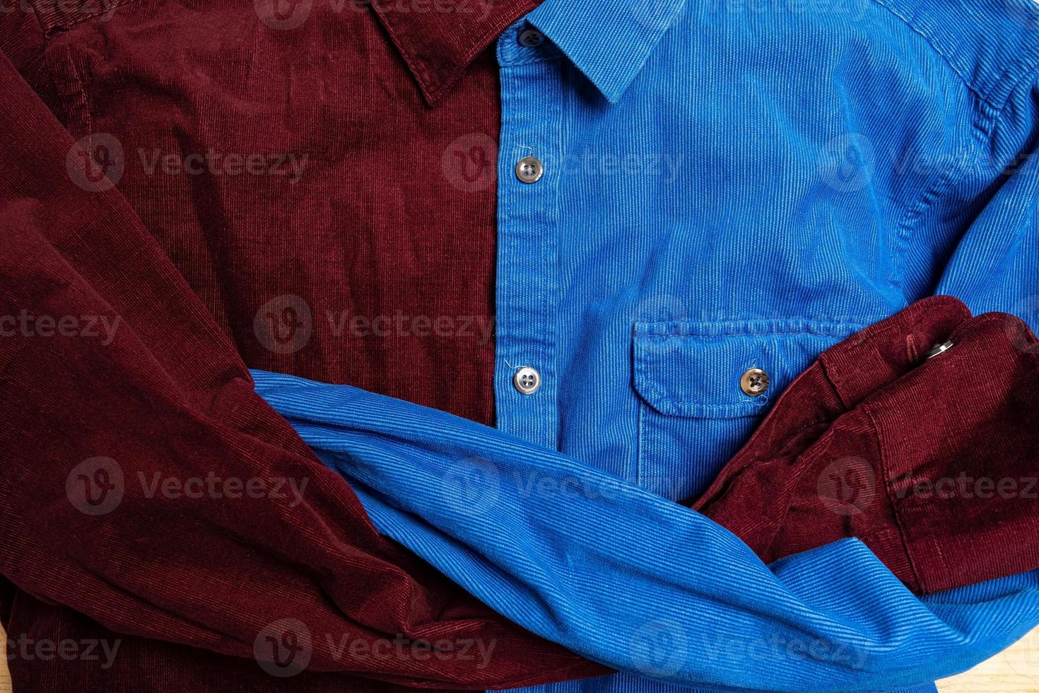 Different shirt are buttoned together with crossed sleeves, looking serious. Flatley. Creative idea photo