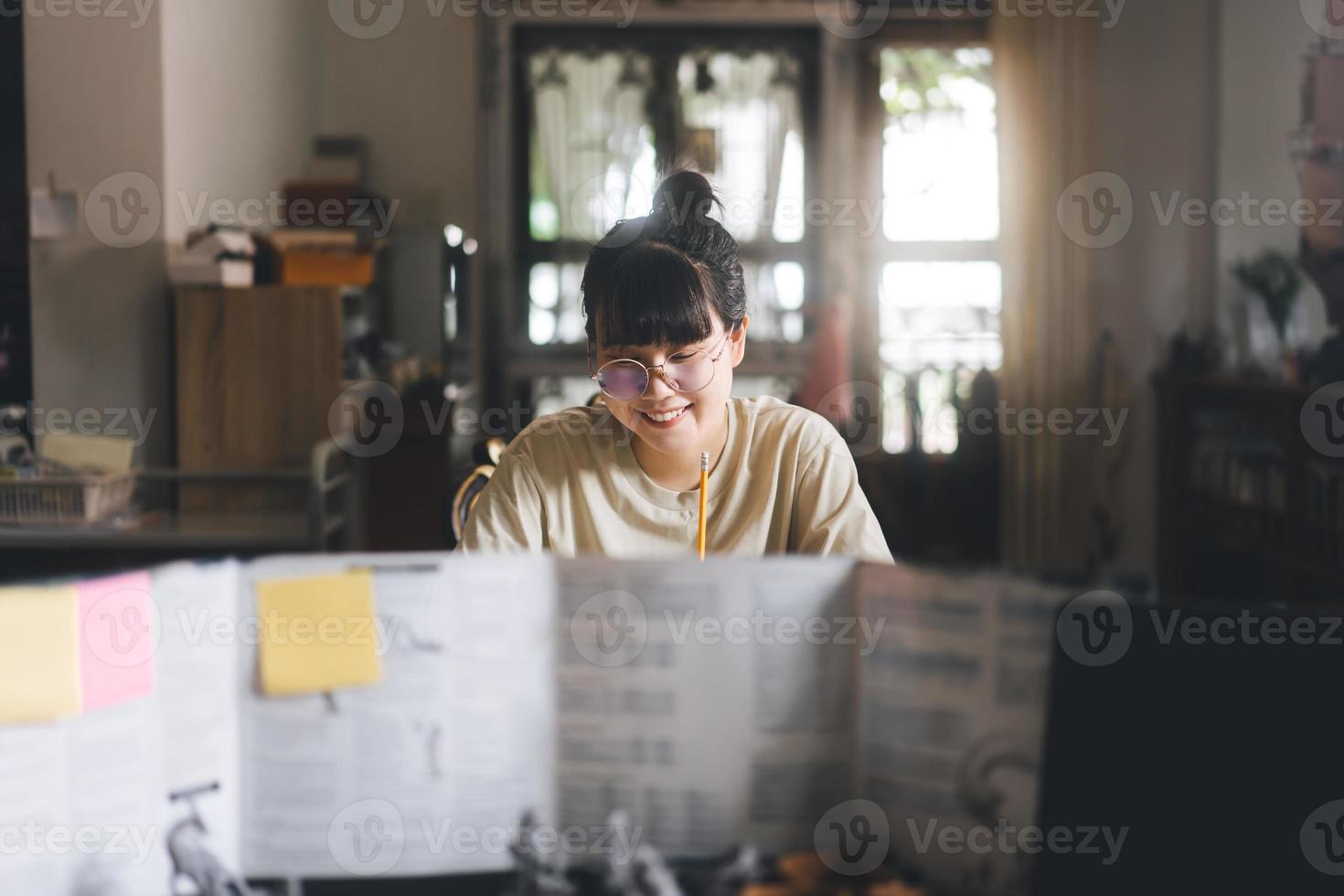 Young adult asian woman enjoying role playing tabletop and board games photo