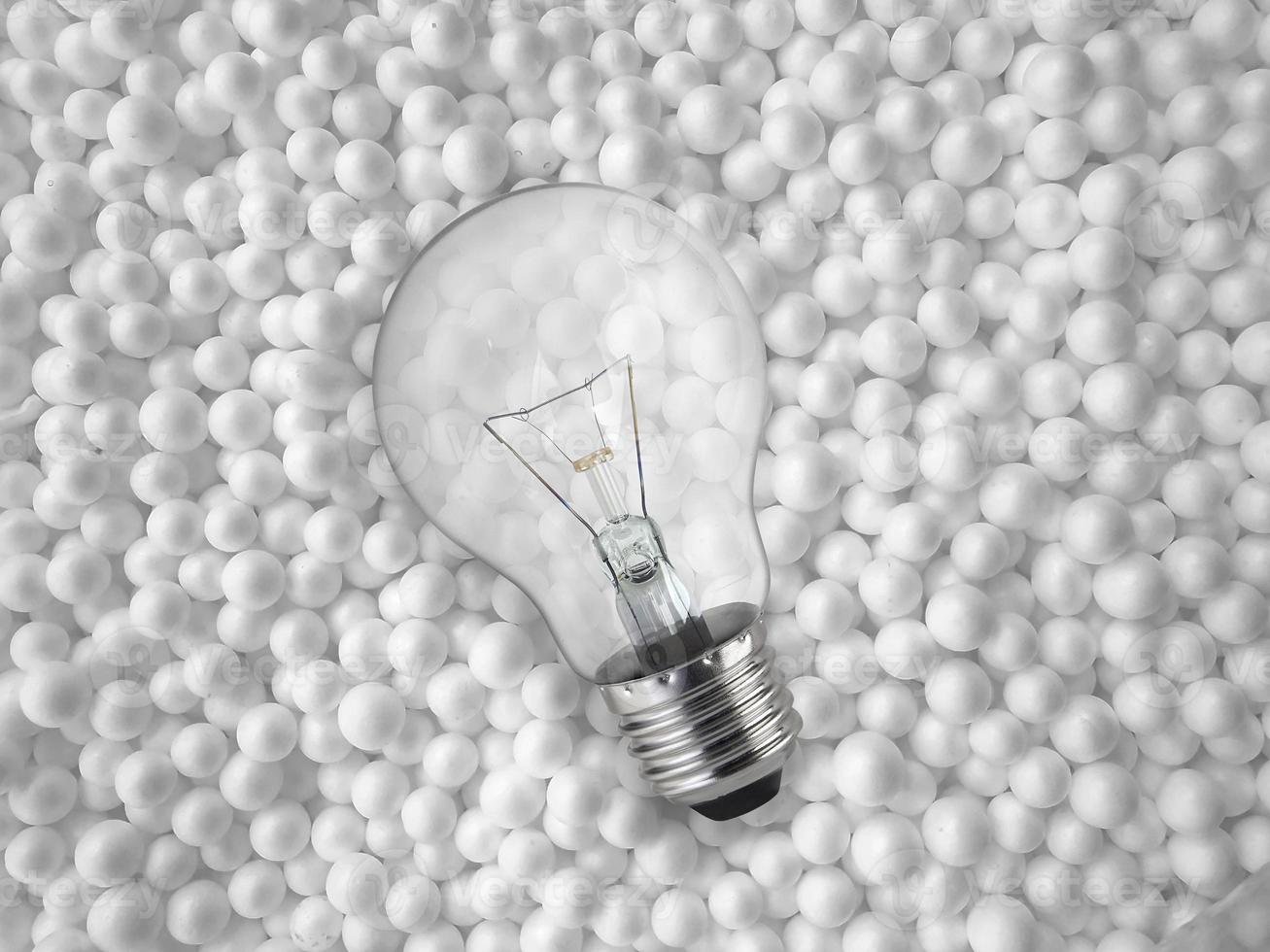 light bulbs on background of white styrofoam ball photo