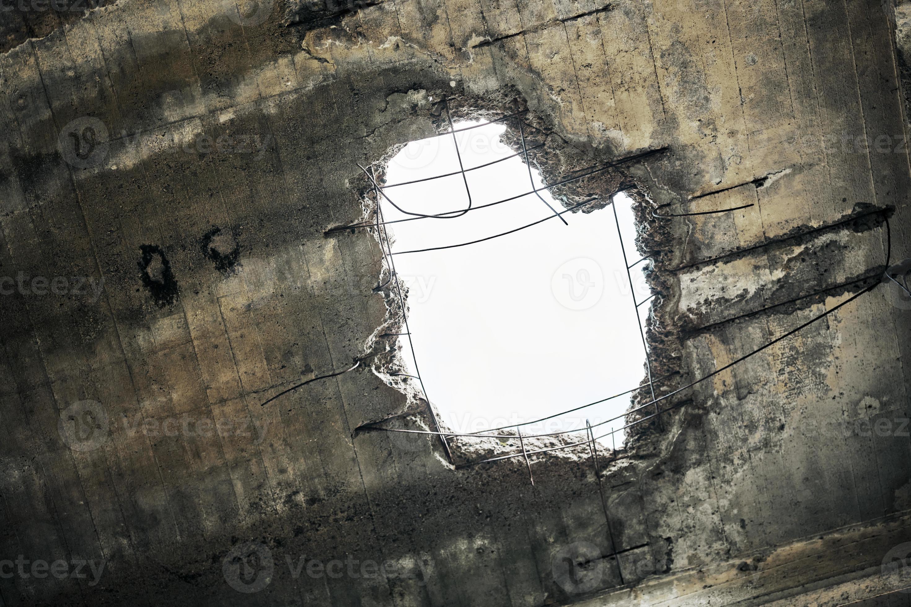 Vintage abandoned damaged house roof with hole in ceiling overlooking