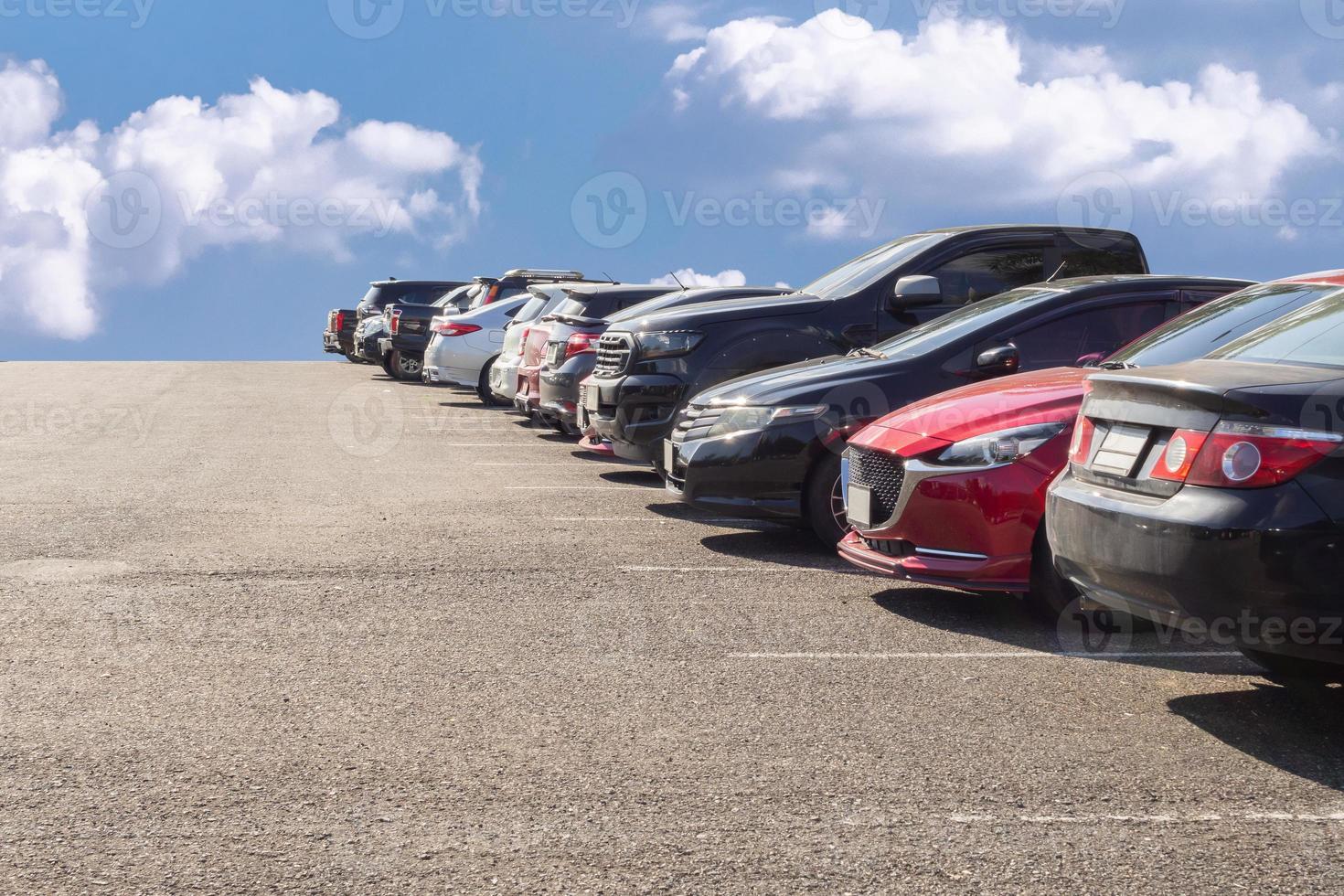 Lot of used car for sales in stock with sky and clouds photo