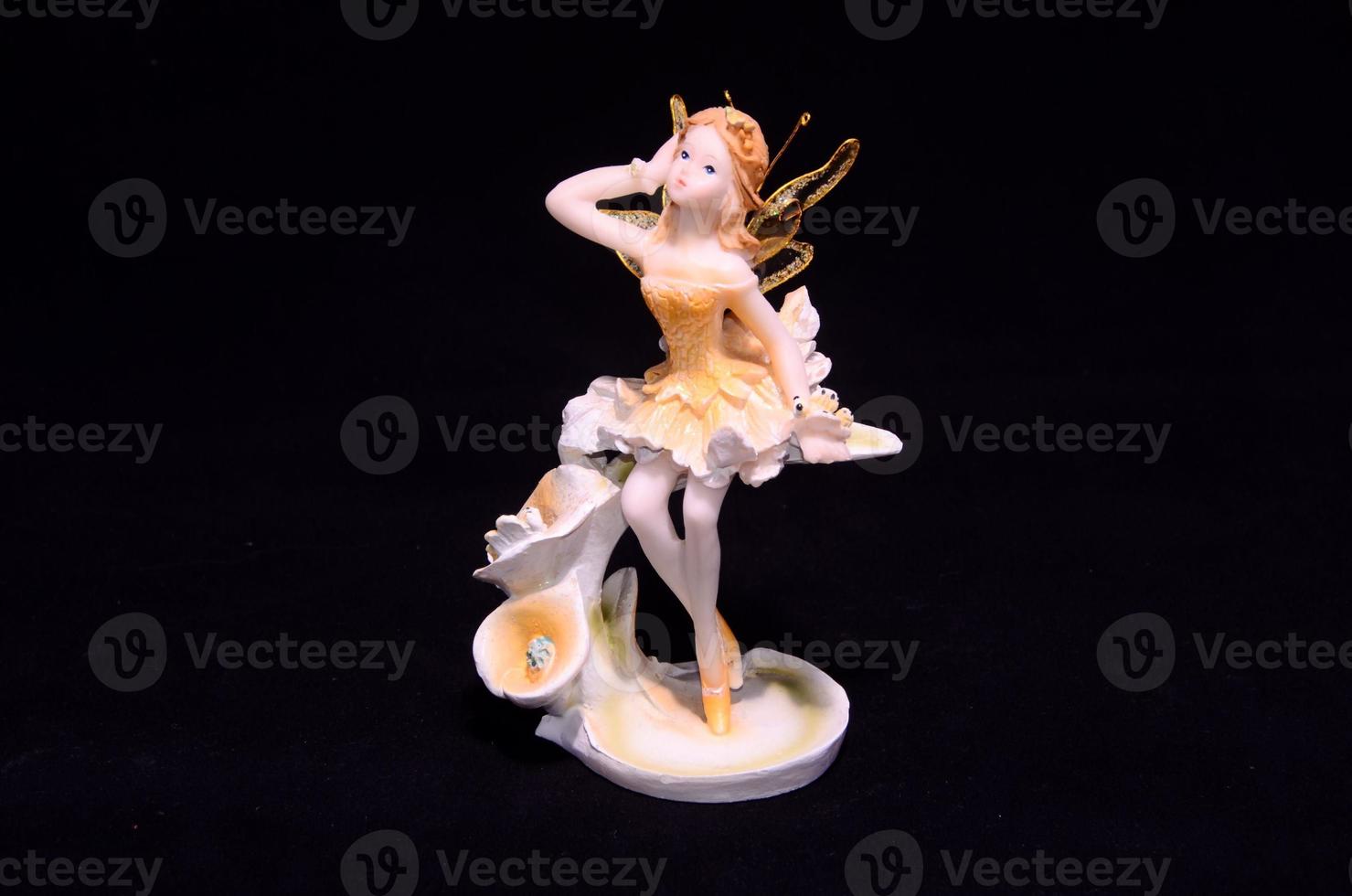 Fairy miniature on black background photo