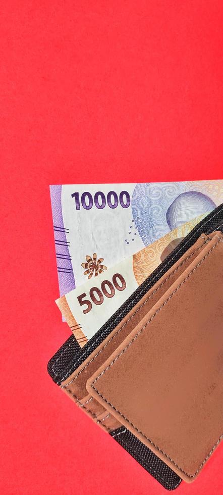 Portrait of Indonesian new banknotes in the wallet. photo
