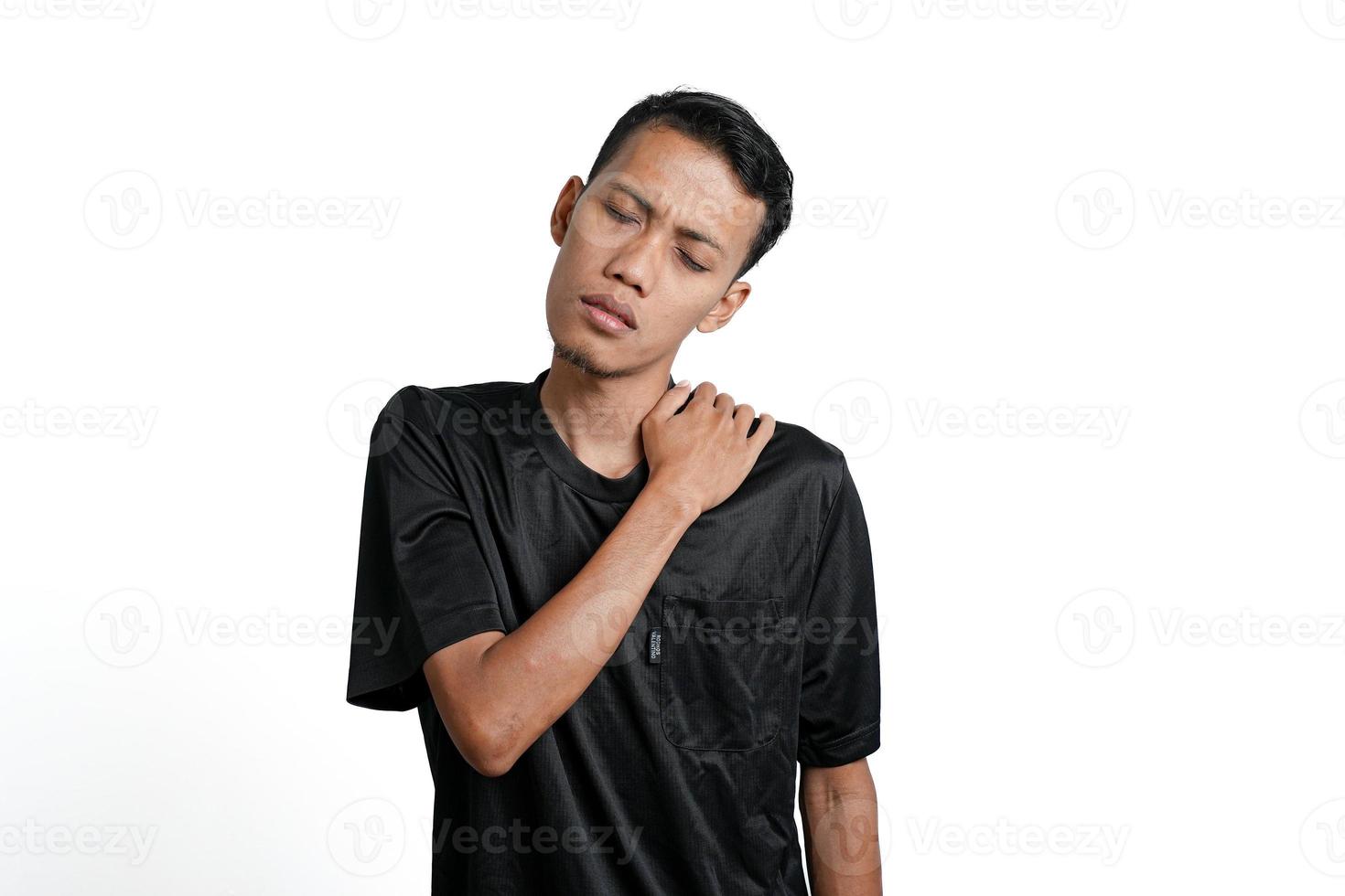 Asian men wearing black training shirts, with tired, achy, tired and lethargic body gestures. Isolated by white background photo