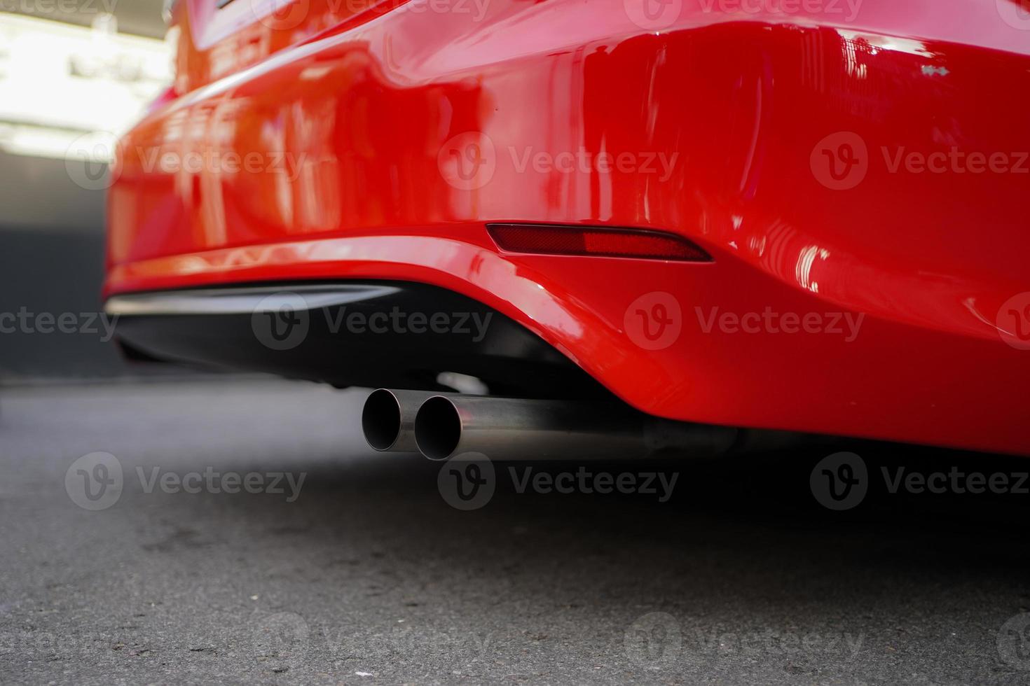 Stainless exhaust pipe at the bottom of car selective background photo