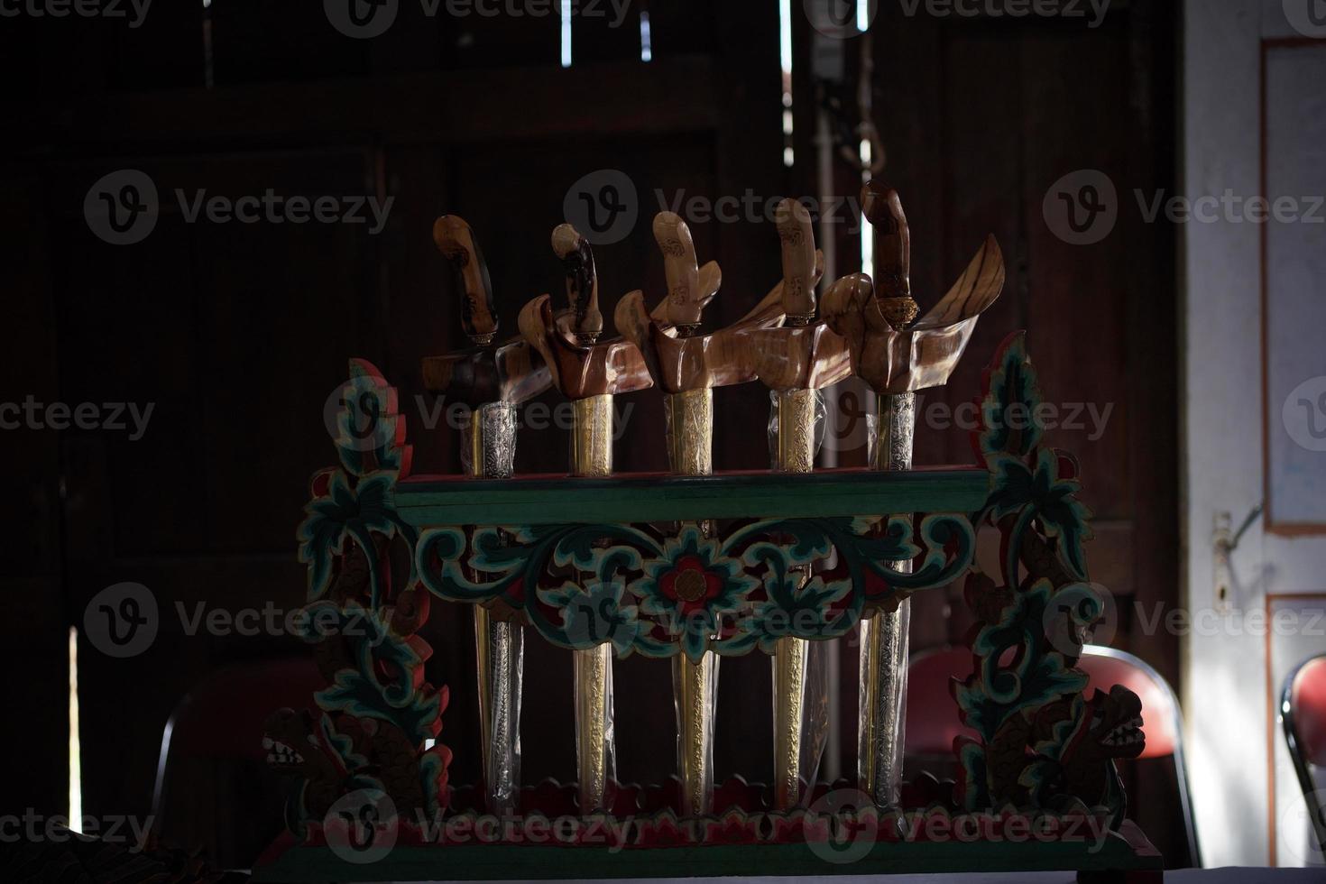 The Javanese keris that is being displayed is a traditional weapon photo