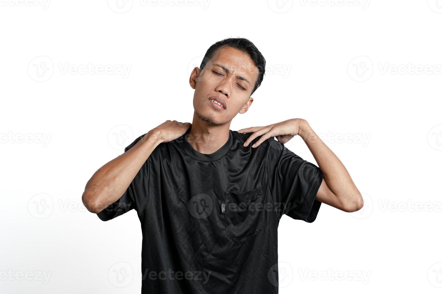 Asian men wearing black training shirts, with tired, achy, tired and lethargic body gestures. Isolated by white background photo