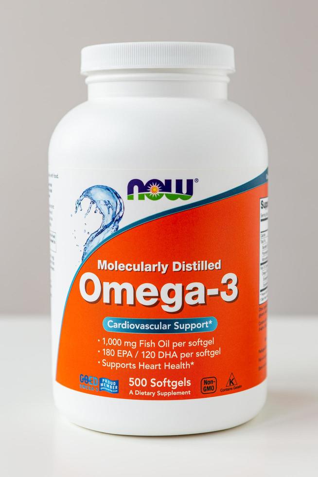 Kyiv, Ukraine - 27 January 2022 Now Foods Omega-3 natural fish oil concentrate - purified at the molecular level. Jar with of omega capsules for cardiovascular support from Natural Organic Wholesome. photo