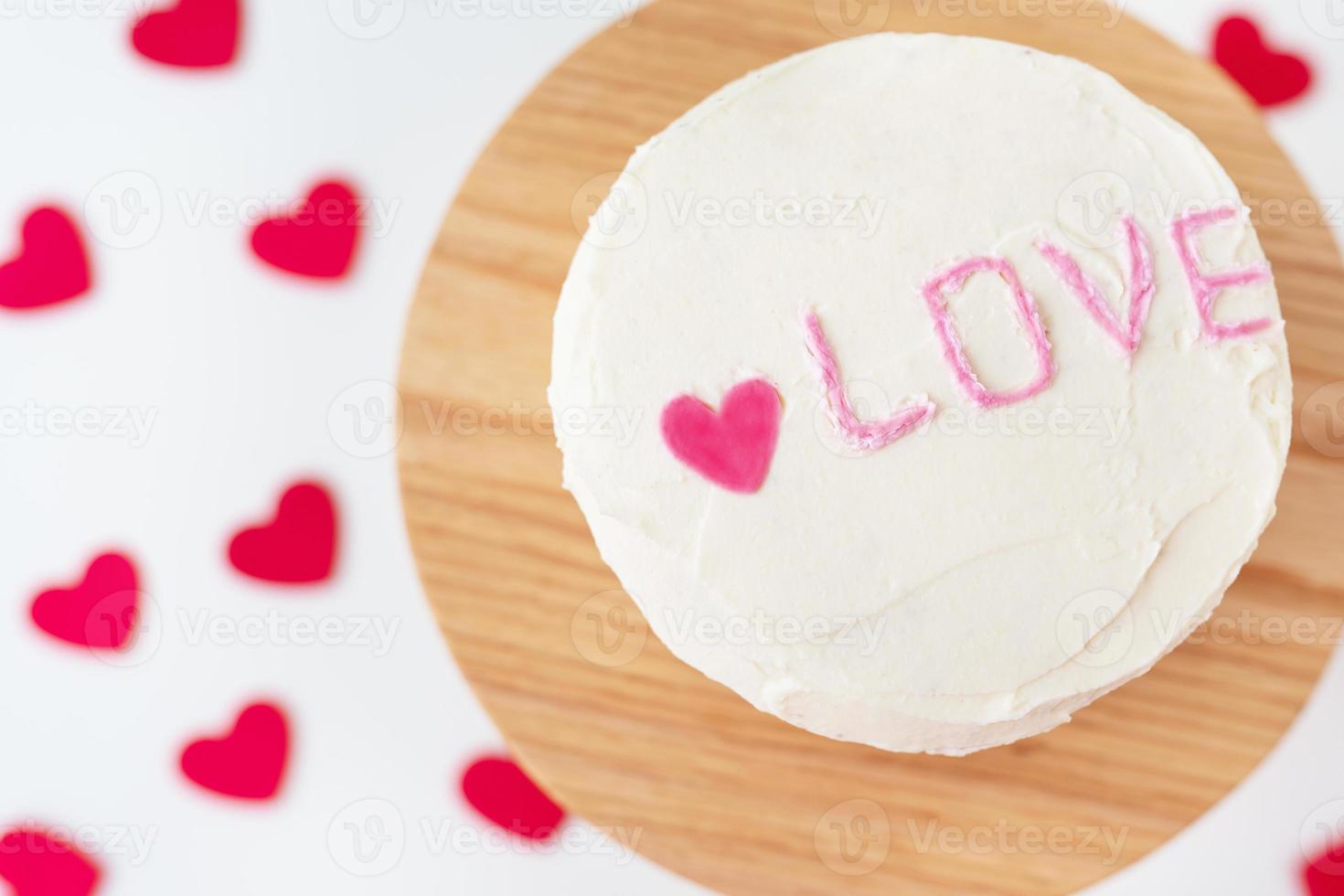 Bento cake with the inscription Love and hearts. A small Korean cake for one person. A cute dessert gift for a loved one for any holiday. Valentine's Day. photo