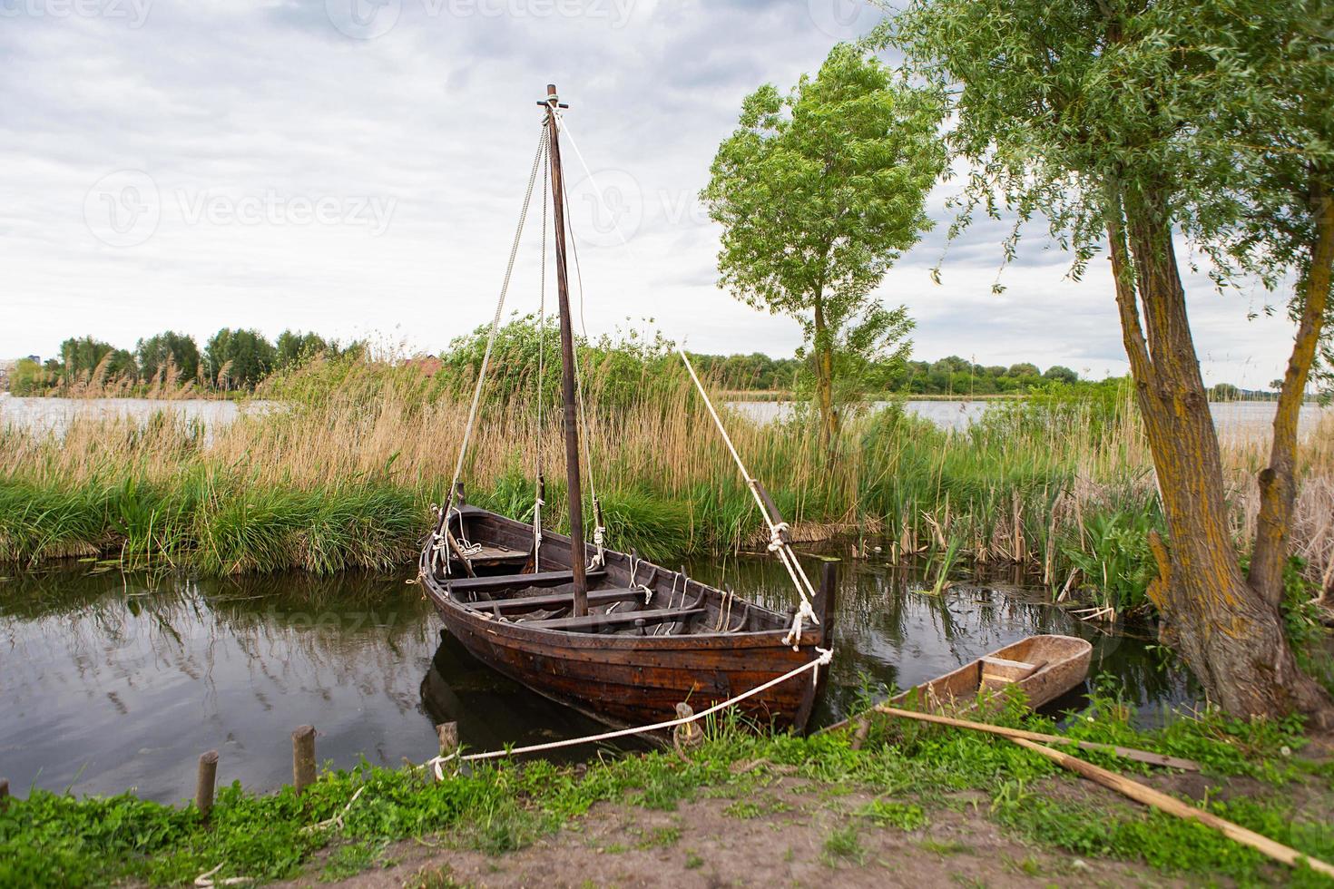 The long ship is for the Vikings. Boat Drakkar. Viking transport ship. Historical reconstruction. photo