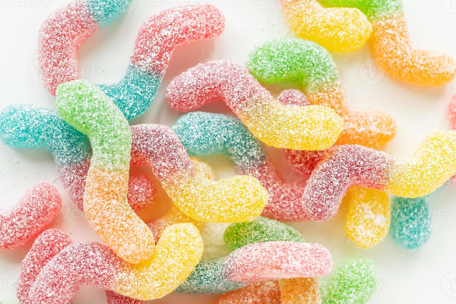 Colorful tasty jelly candies on a white background, top view. photo