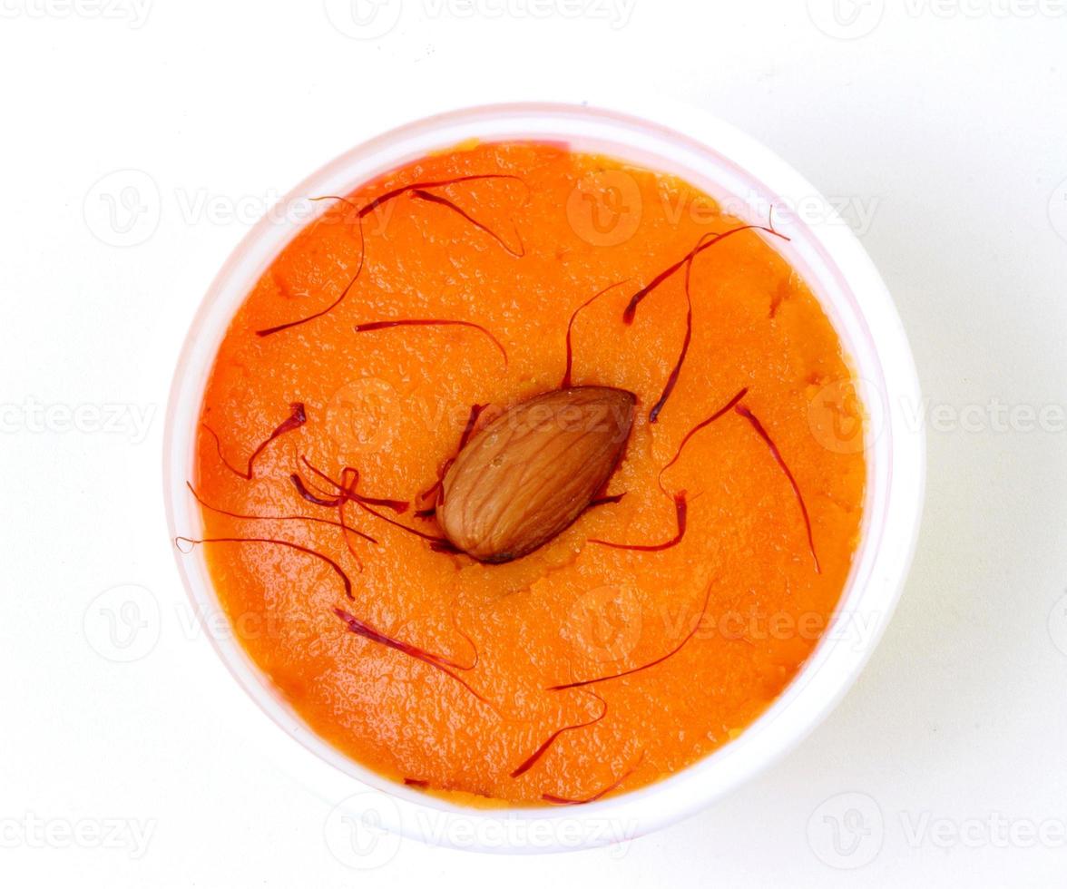 Halwa with garnish in the round with background photo
