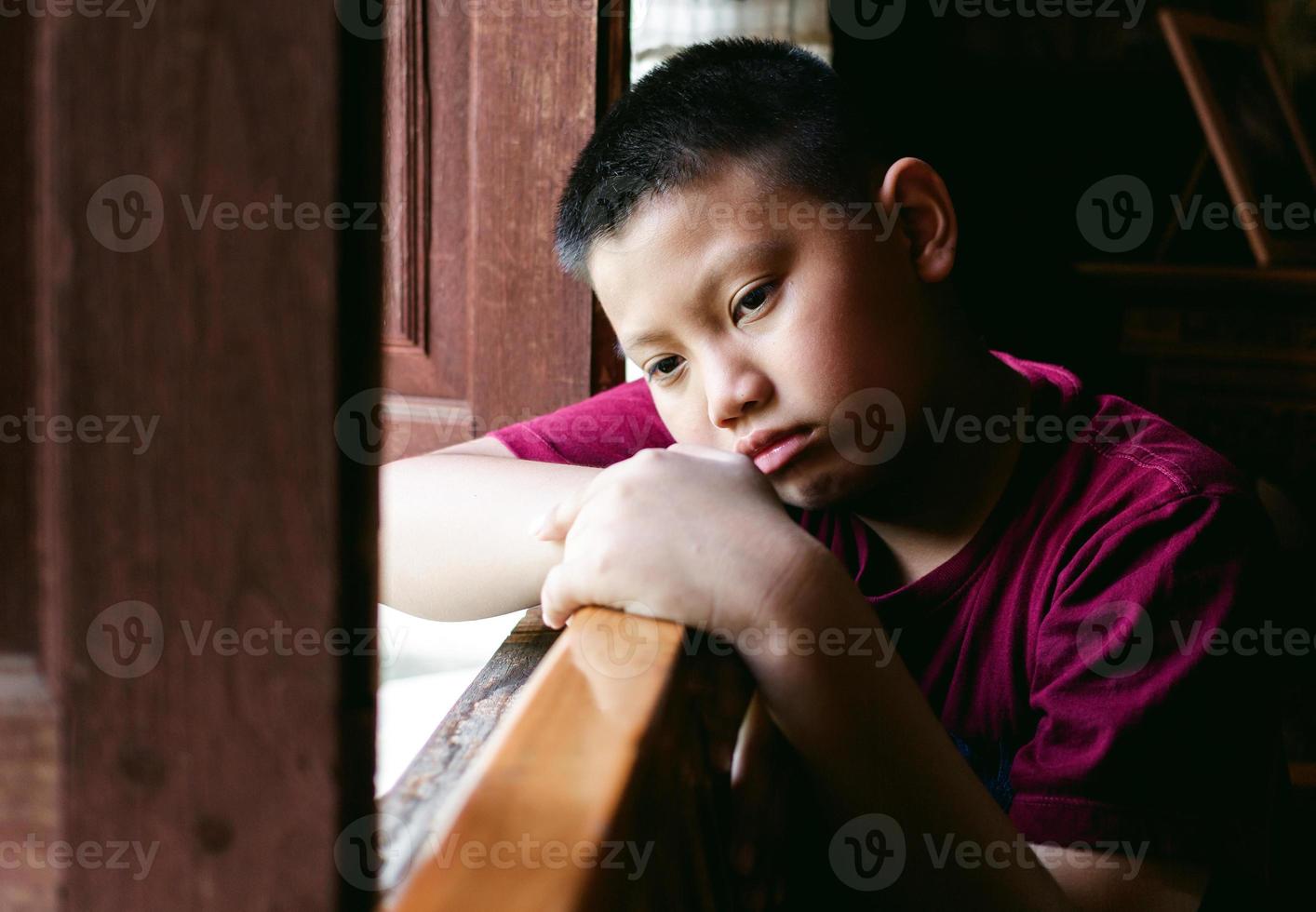 Portrait of a little Asian boy, Kid sad face, Unhappy child looking out, Emotion sad and sad face, depression children concept photo