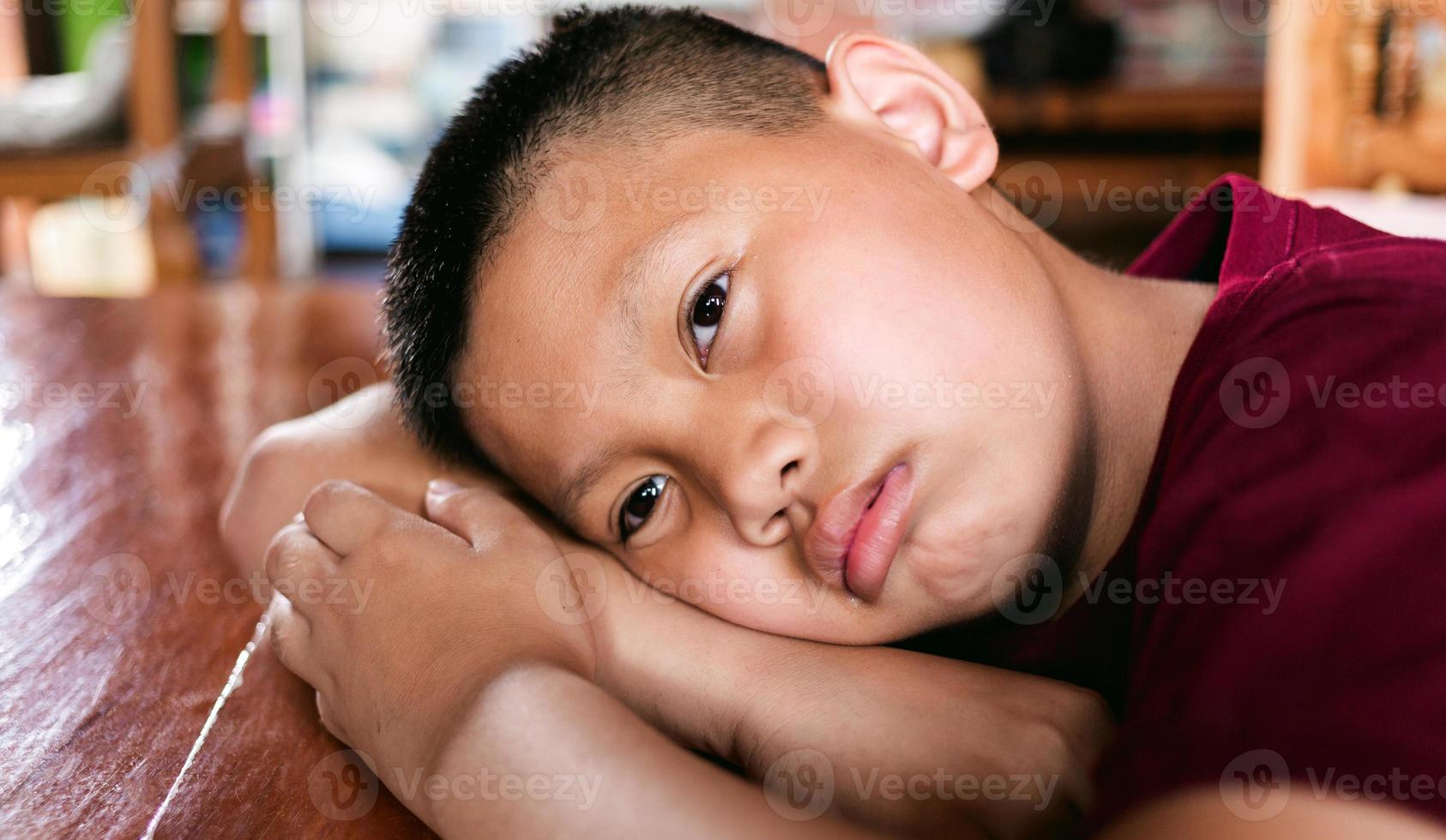 Portrait of a little Asian boy, Kid sad face, Unhappy child looking out, Emotion sad and sad face, depression children concept photo